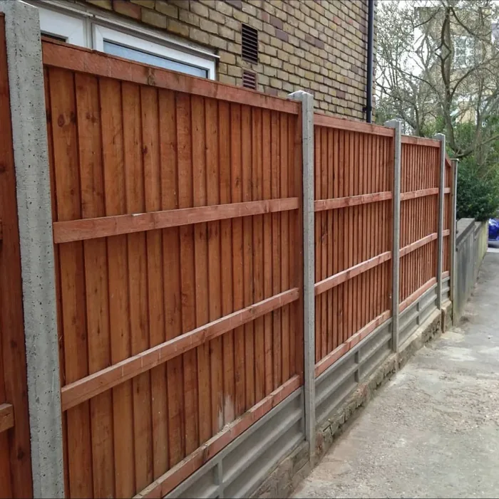 Closeboard fence panels with concrete posts and gravel boards along a side driveway in Orpington